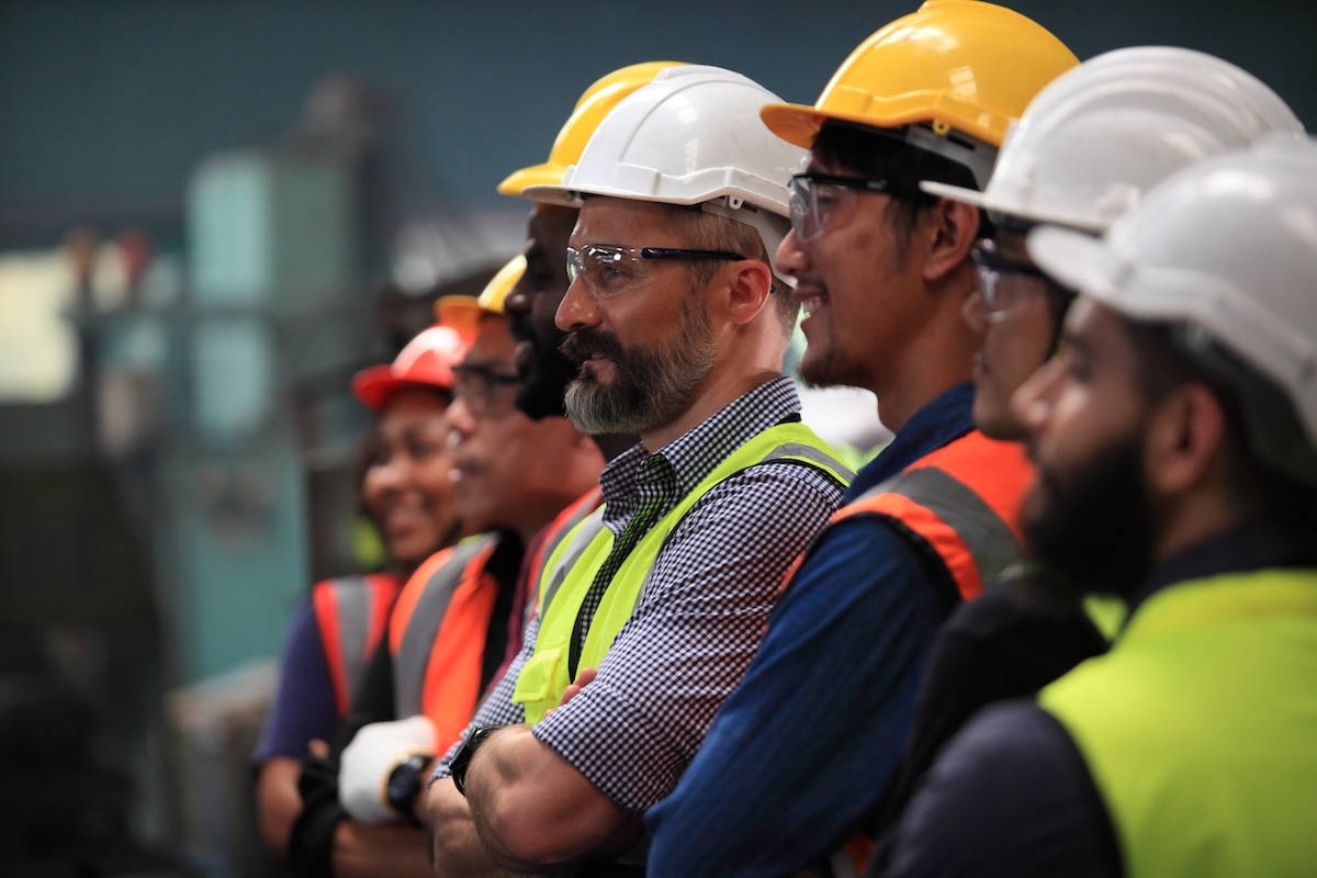 Team lined up with hard hats